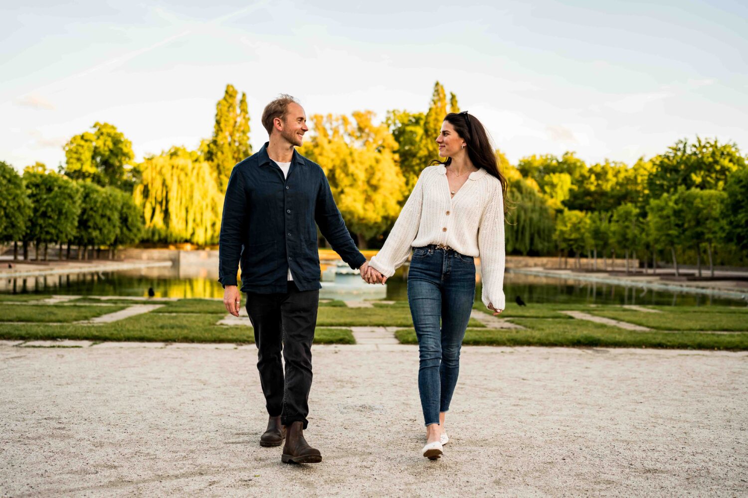 man and woman looking at each other holding hands